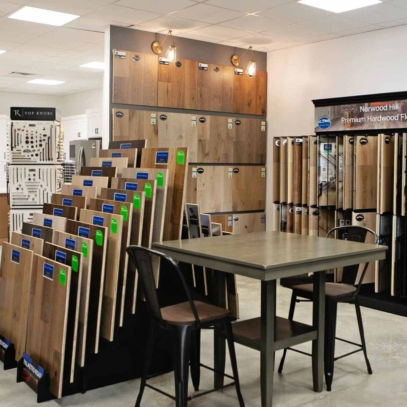 Flooring display area inside the Pool Brothers showroom in Moultrie, Georgia featuring hardwood flooring samples, design consultation space, and home remodeling products.