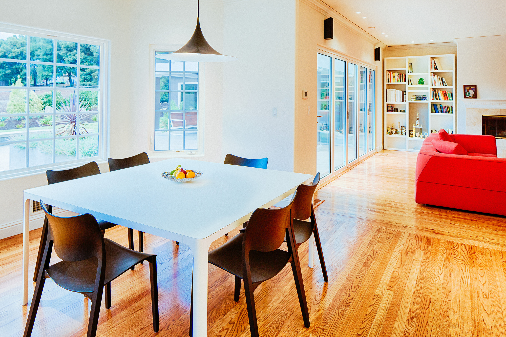 White dining table with dark chairs