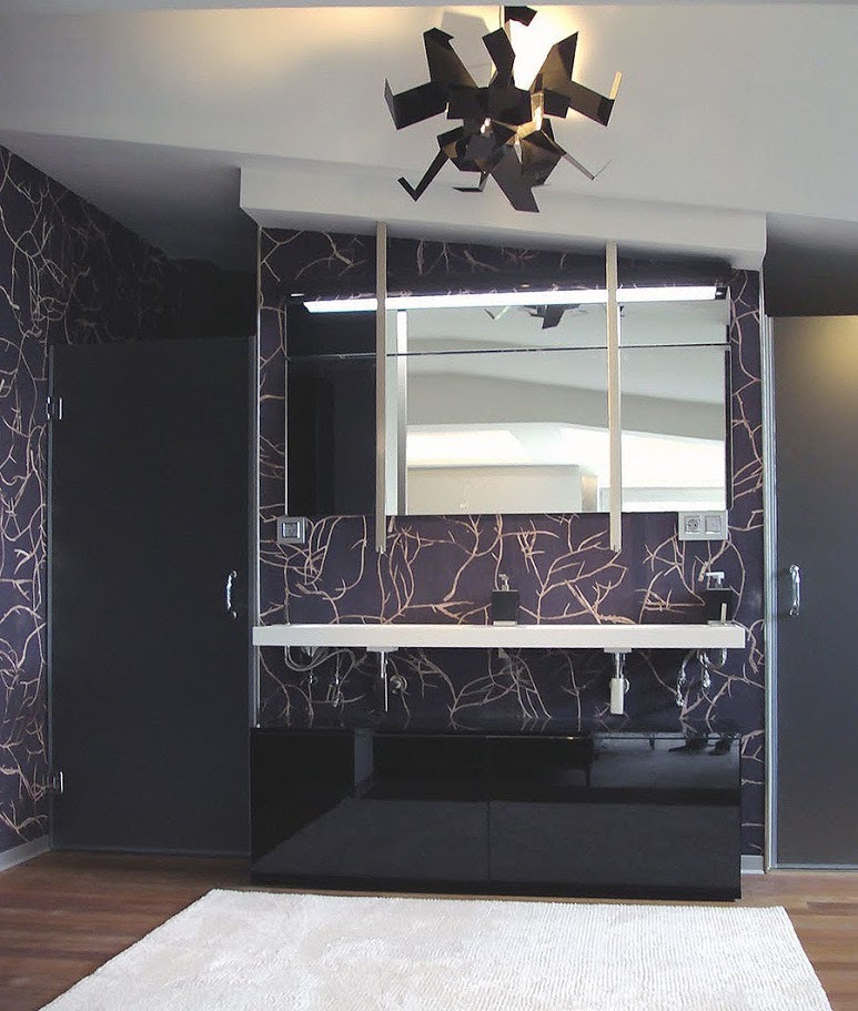 Black glossy vanity, ceiling faucets and white floating countertop