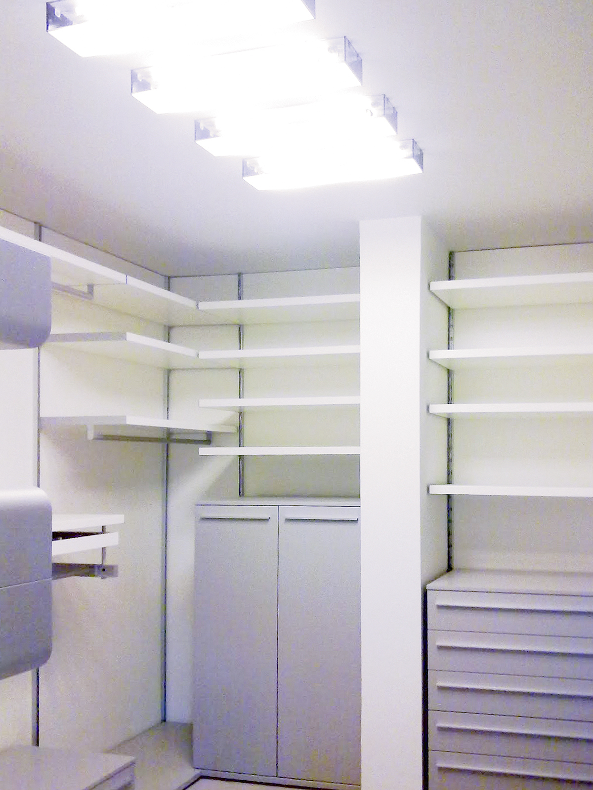 modern walk-in closet cabinets with surface light on ceiling