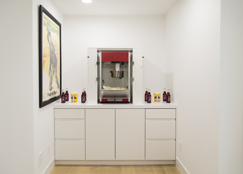 white cabinets with a popcorn machine