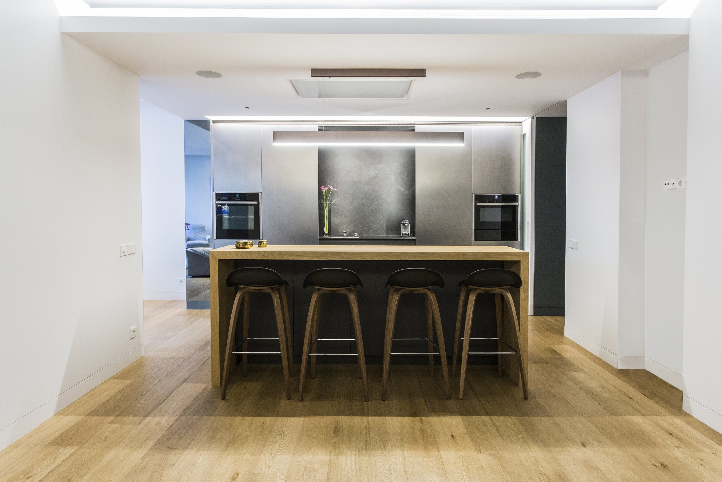 modern kitchen island with oak bar