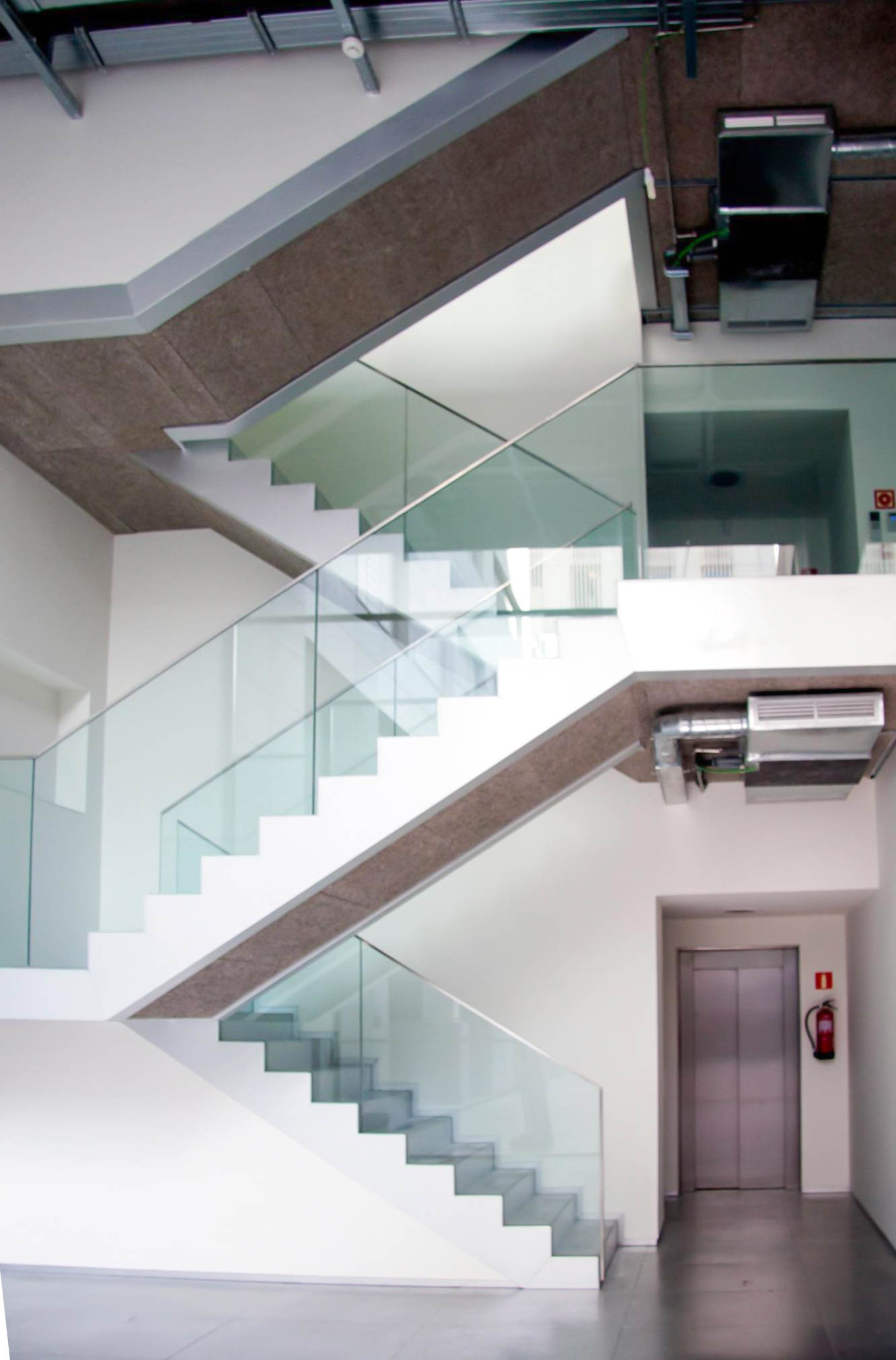 modern staircase with glass railing