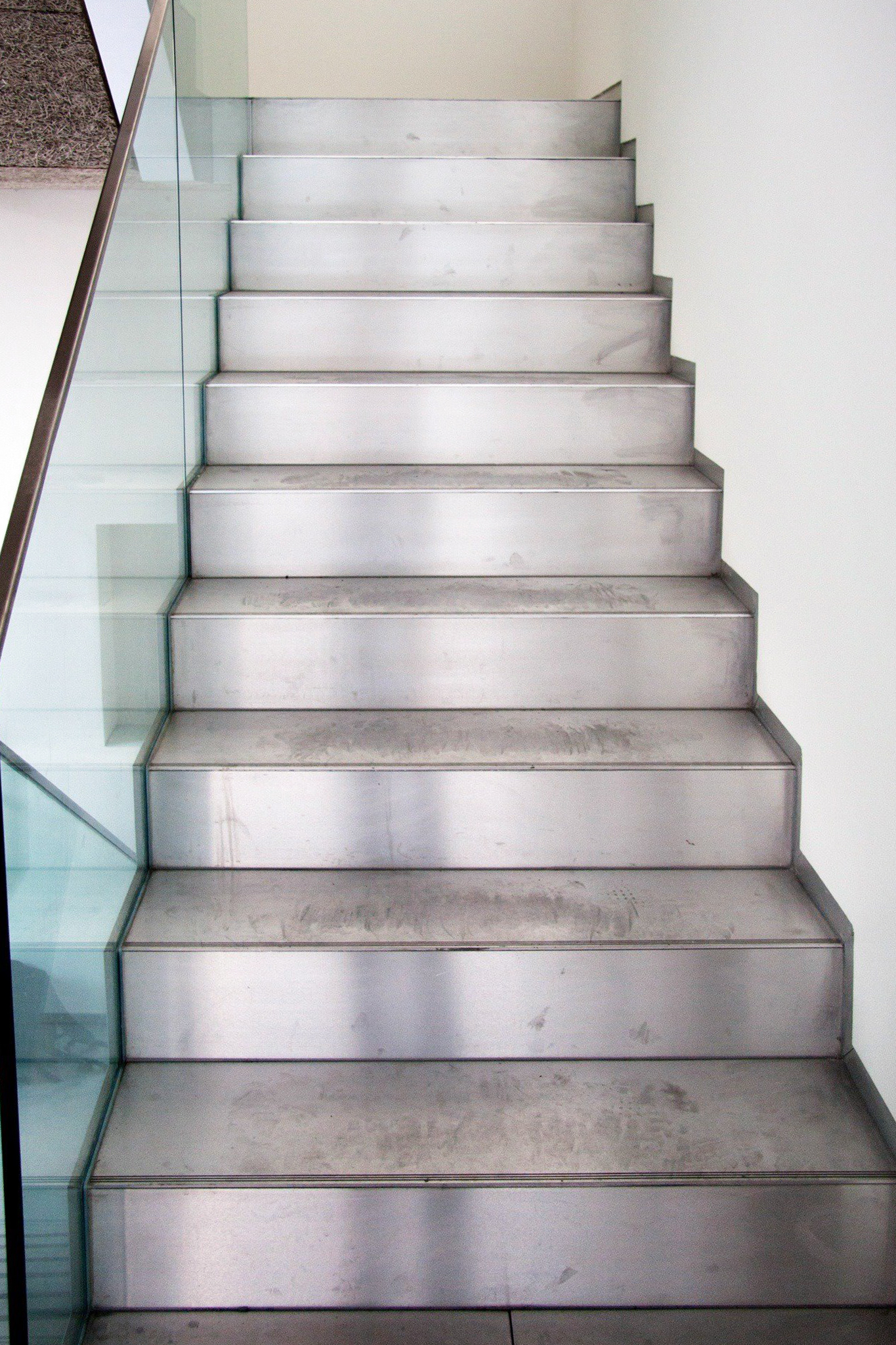 Modern steel staircase with glass railing