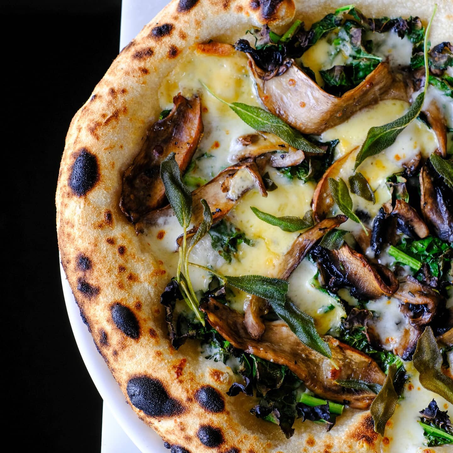 Kicking off the month with a beautiful roasted Mushroom Pizza with cavolo nero, smoked cheddar, fior di latte &amp; fried sage 🍄🍕