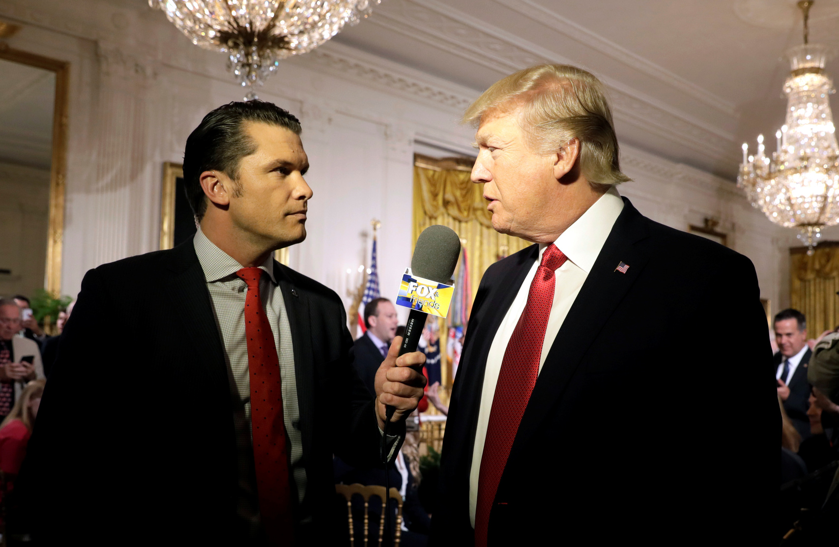 President Donald Trump is interviewed by Fox & Friends host Pete Hegseth, the former executive director of the Concerned Veterans for America.