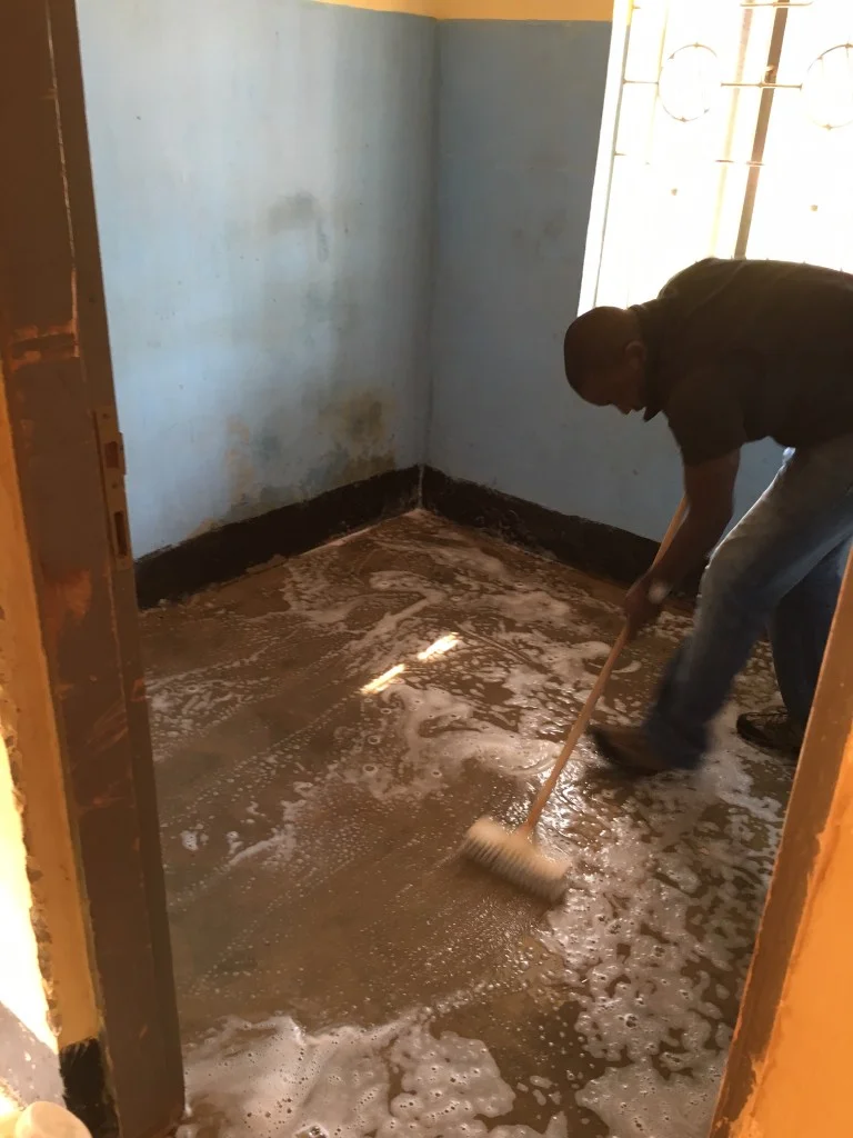 The ITWA team prepares the new ultrasound room at Kasambya.