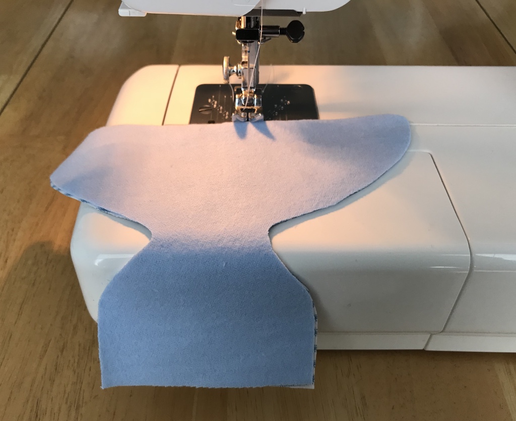 You will want to start your sewing at the widest part of the dia- per (also known as the back)