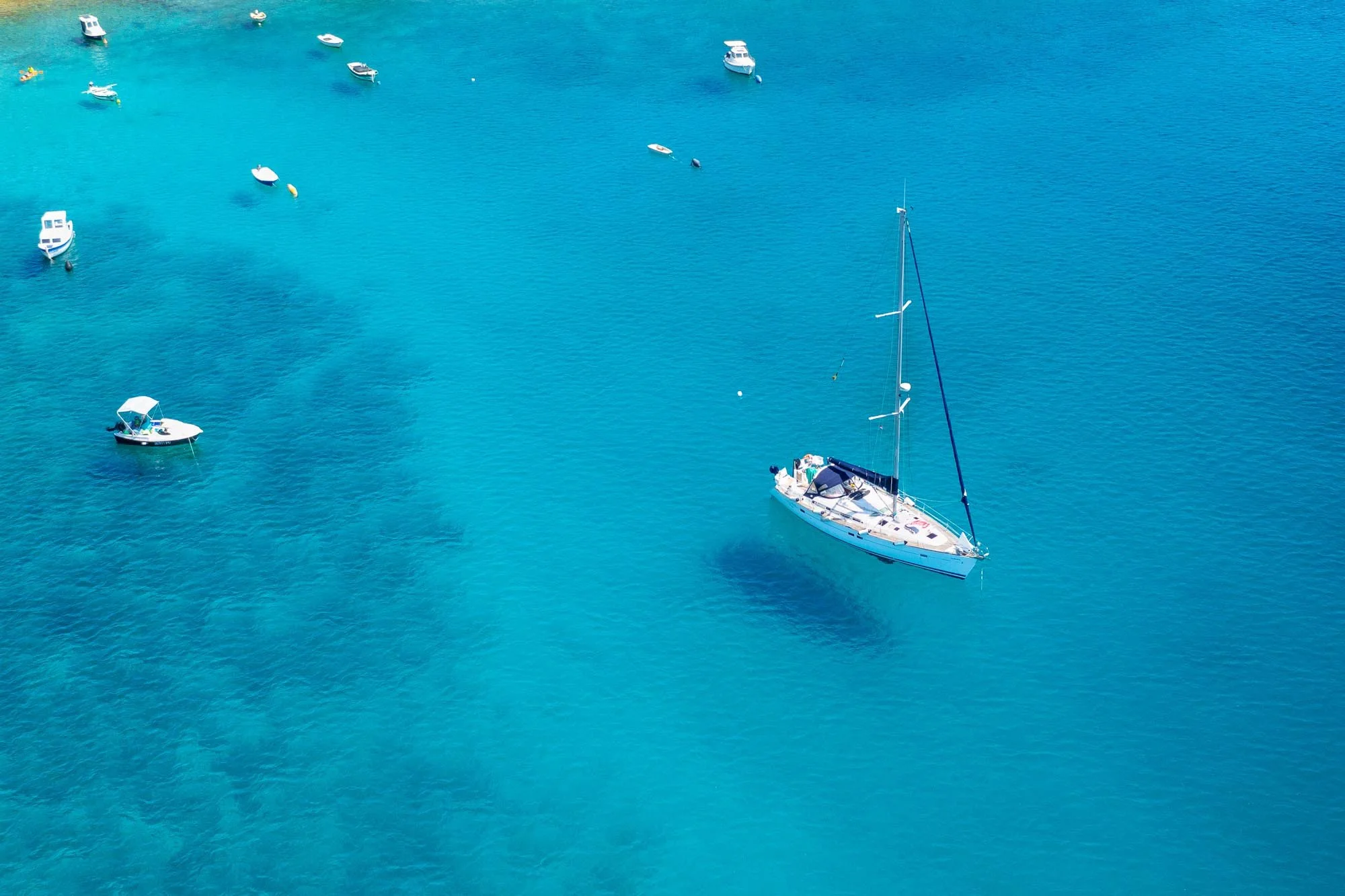 aerial-view-of-sailboat-and-small-boats-or-yachts-2022-01-28-09-58-54-utc.jpg