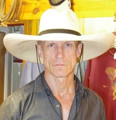 Clay wearing an oversized cowboy hat.JPG