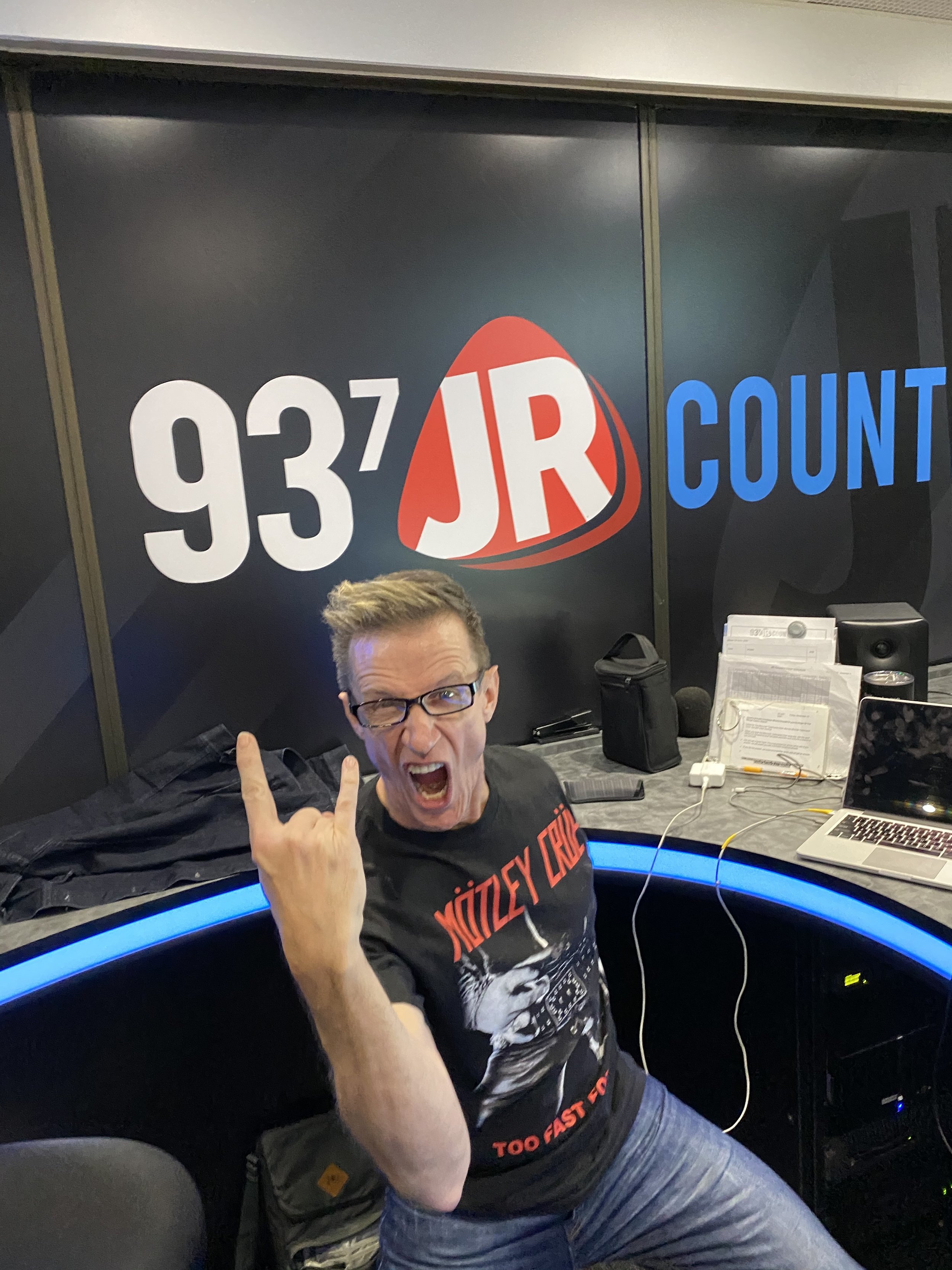 Clay in the radio booth at 93.7 JR Country.jpeg
