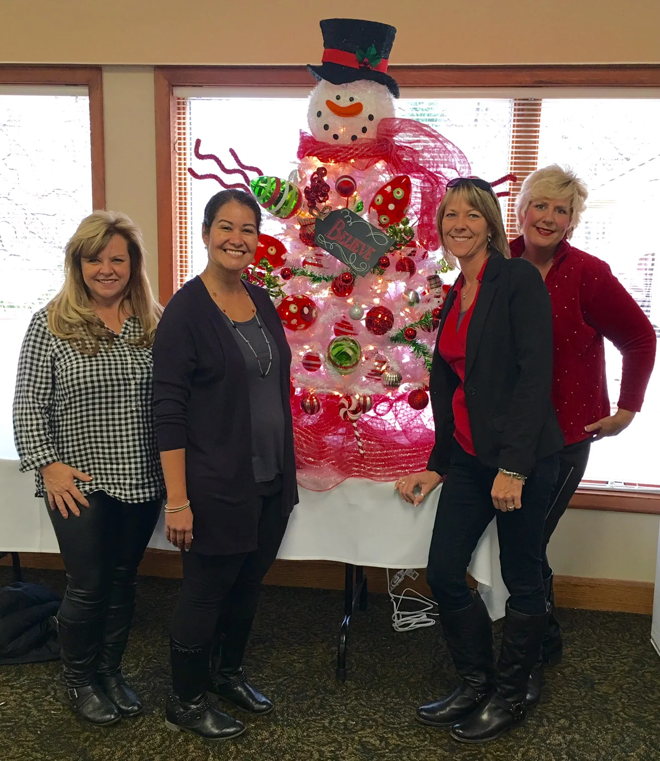 The Linda Rea Team brings a “snowman” to the Festival of Trees