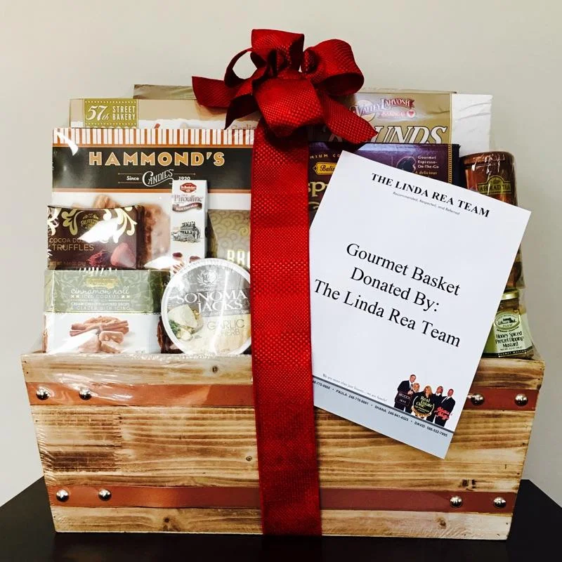 The Linda Rea Team Donates Gift Basket To Notre Dame Preparatory School