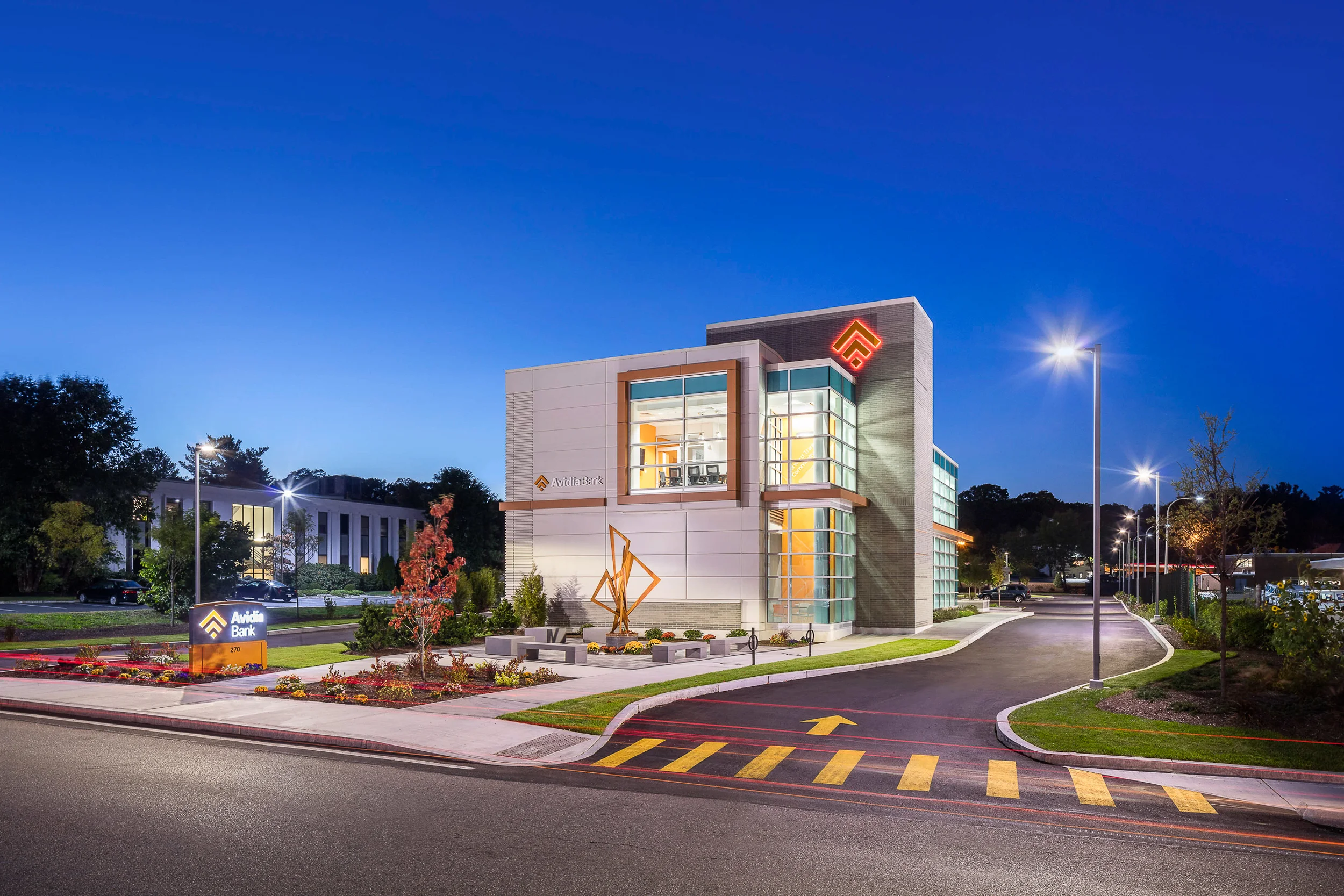 Avidia Bank at dusk Framingham MA, architectural design by Studio Q Architecture.
