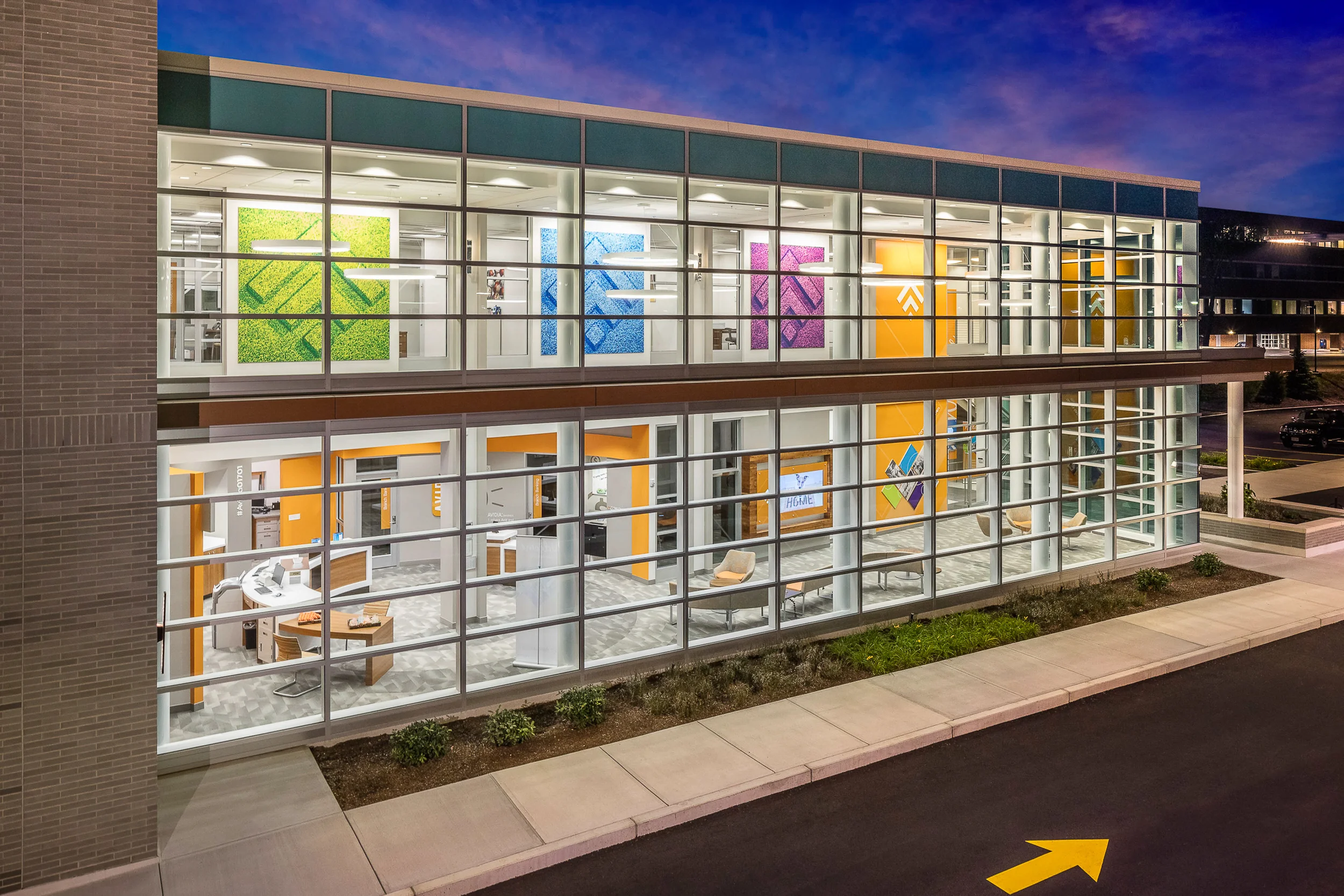 Avidia Bank lobby at dusk in Framingham, MA. Architectural design by Studio Q Architecture.