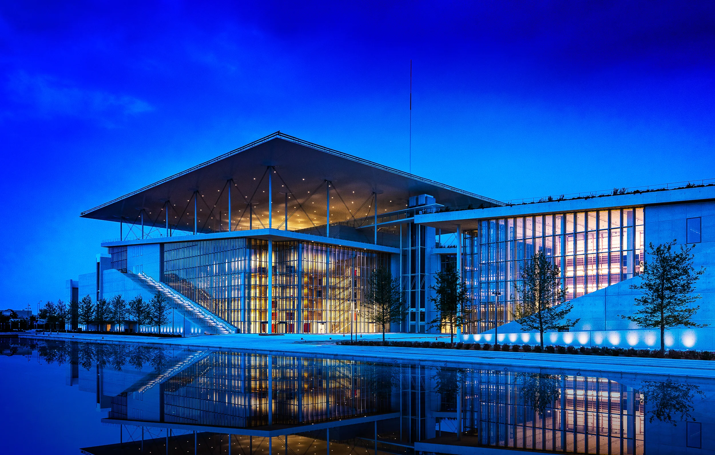 SNF Cultural Center in Kallithea, Greece by Renzo Piano Building Workshop. National Opera beneath 300' x 300' solar panel covered roof and National Library to right.