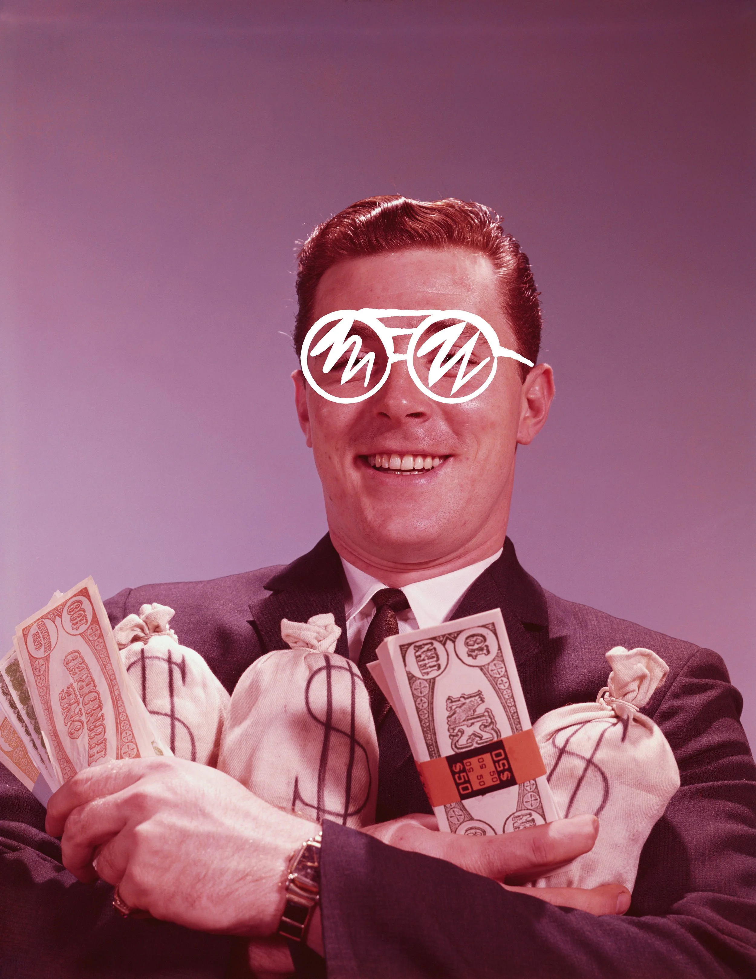 A man with red hair and glasses, wearing a suit, is smiling and holding bundles of money, with some wrapped in rubber bands, in his arms and hands.