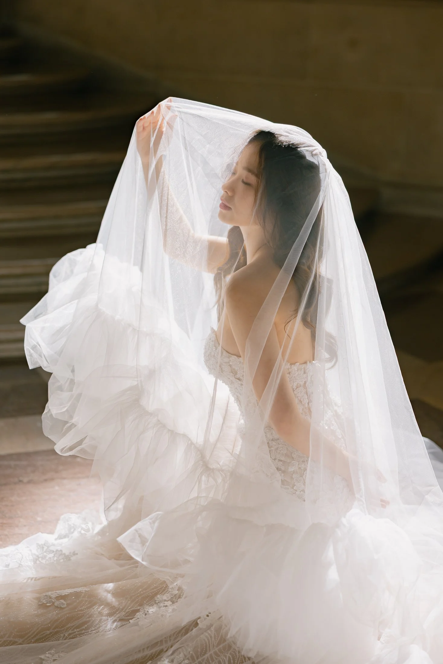 Bride's veil caught in motion at San Francisco City Hall wedding portraits