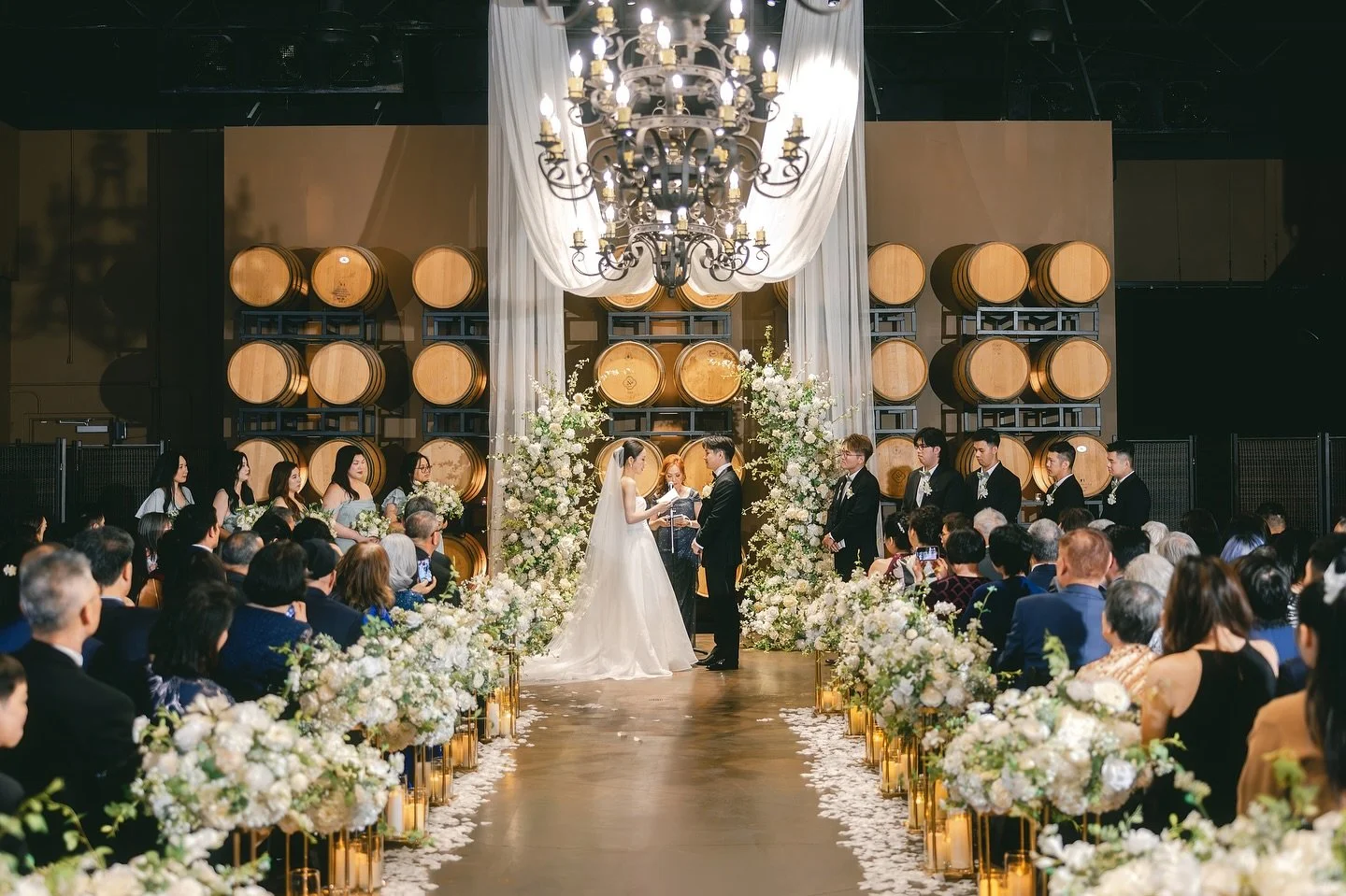 White and green &mdash; such a timeless and elegant color palette that never goes out of style. It fits effortlessly into any venue and instantly adds a touch of sophistication and ceremony. 🤍🌿

The indoor ceremony space at Palm Event Center carrie