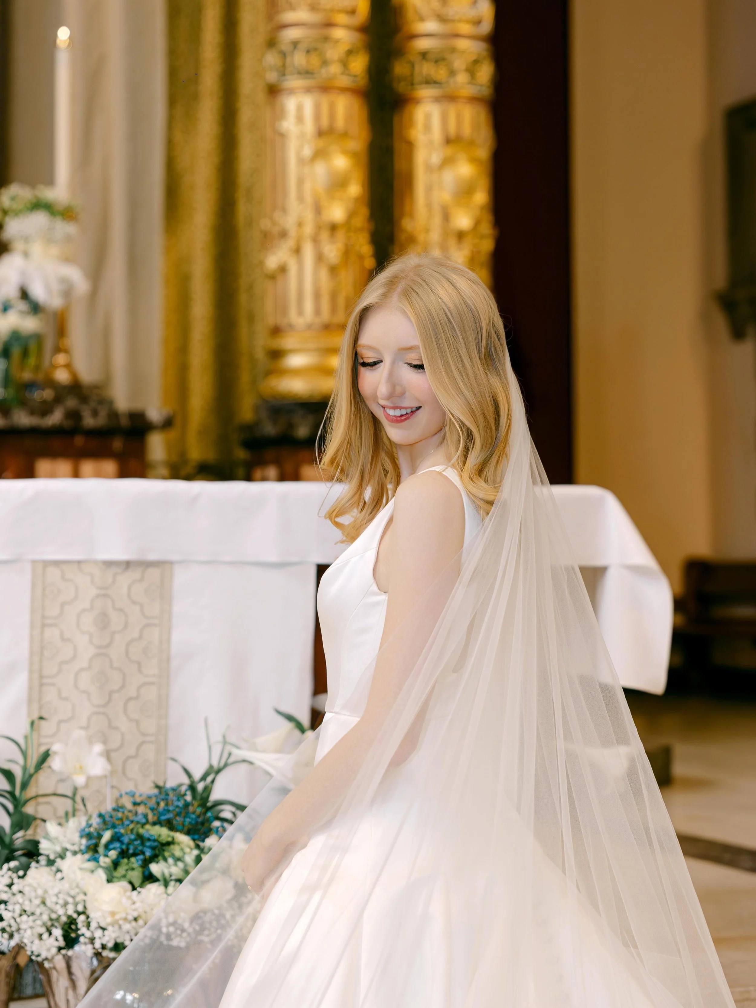 A beautiful Catholic Ceremony at Saint Cecilia Catholic Church.

Wearing her beautiful white gown from @moniquelhuillierbride, Briana slowly walked down the aisle with her parents toward Peter. The moment her father placed her hand into Peter&rsquo;s