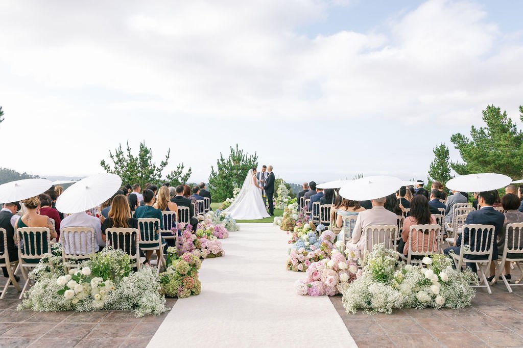 Tehama Golf Club outdoor wedding ceremony in Carmel California with pastel aisle flowers and mountain views