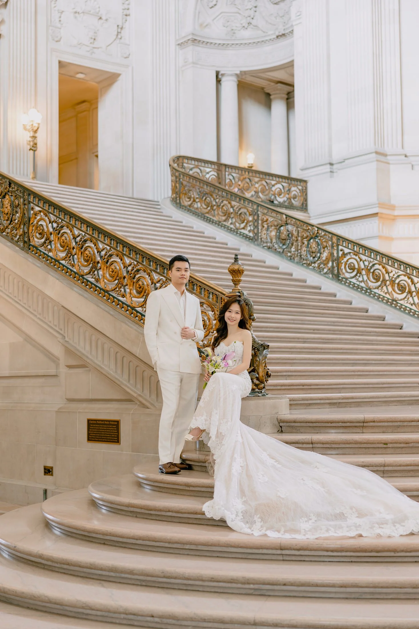 Couple on the grand staircase at SF City Hall elopement session