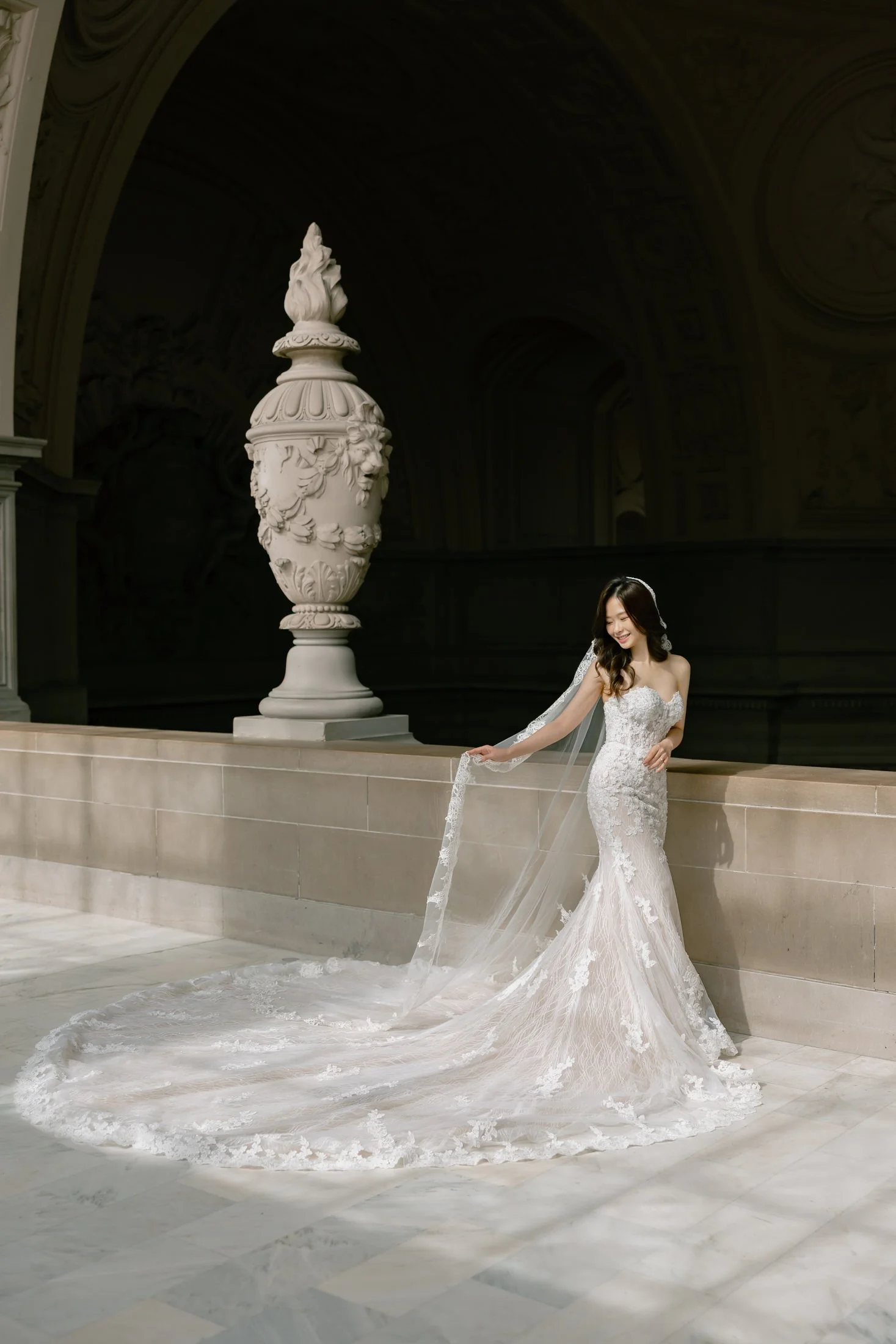 Bride's veil caught in motion at San Francisco City Hall wedding portraits