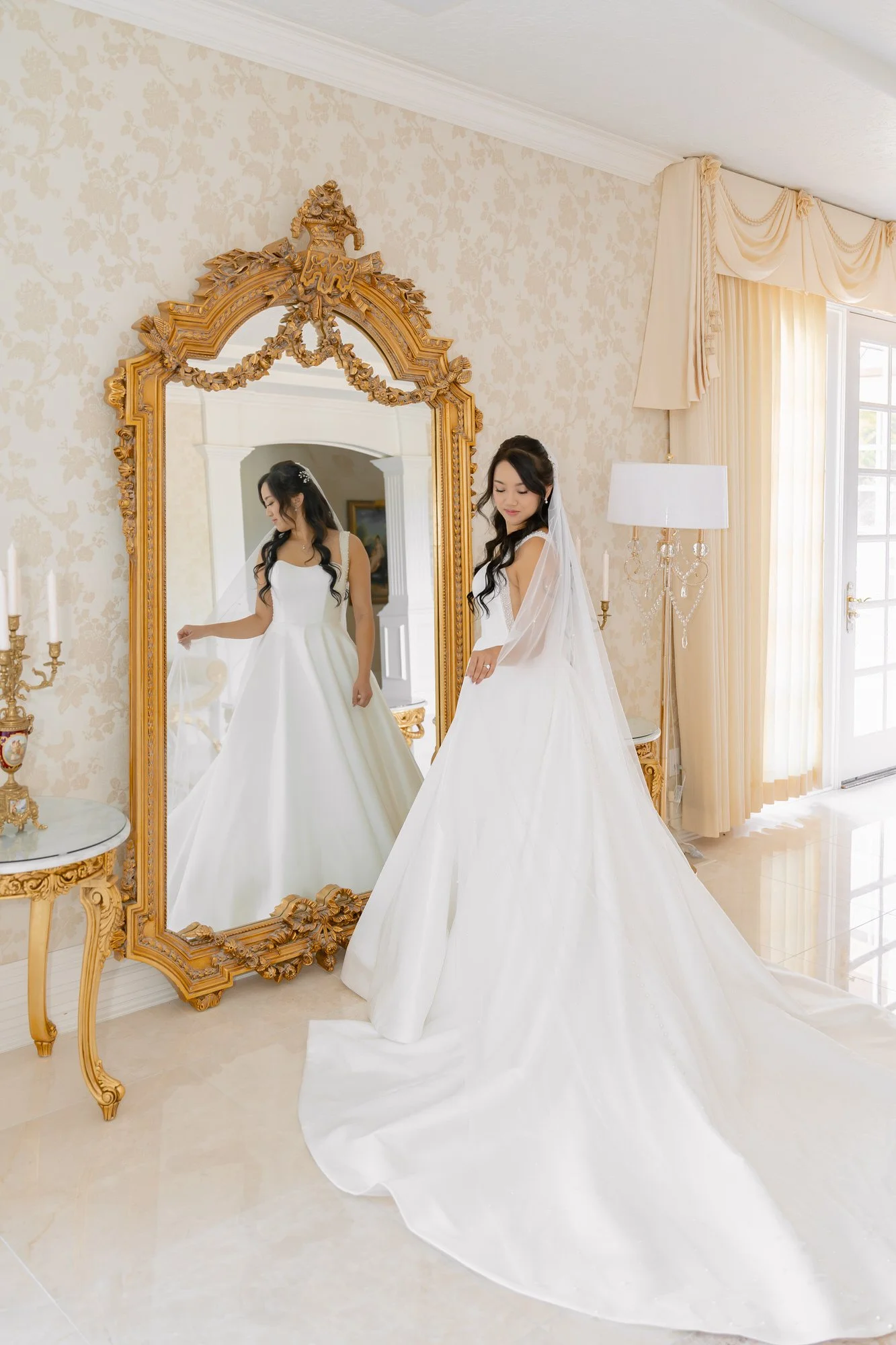 Bride portrait reflected in an ornate gold mirror at Château de Michellia wedding venue in Salem, Oregon.