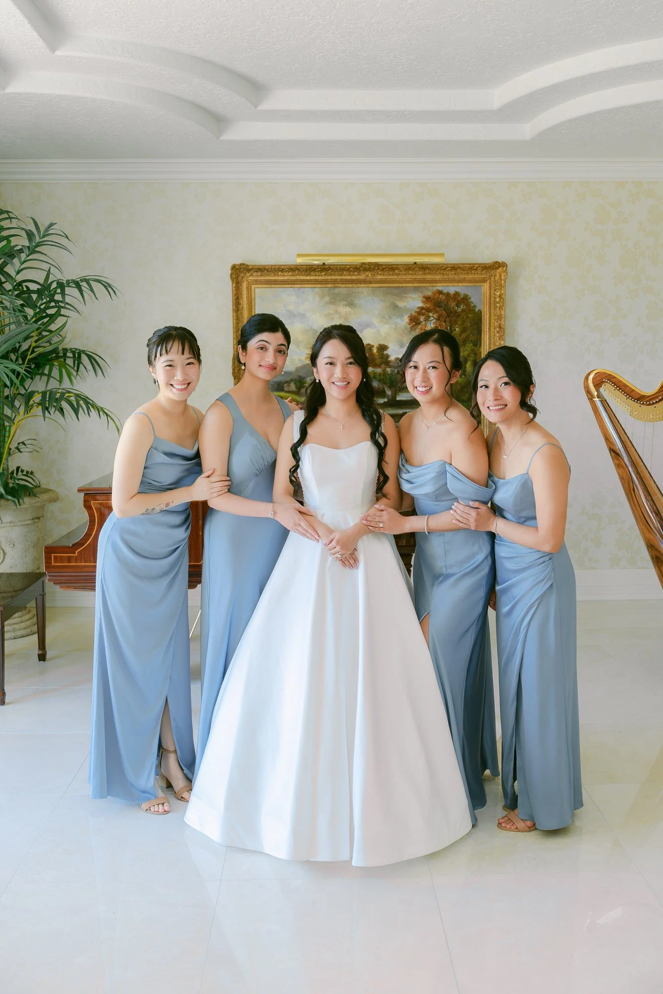 Bride and bridesmaids portrait inside Château de Michellia wedding venue in Salem, Oregon.