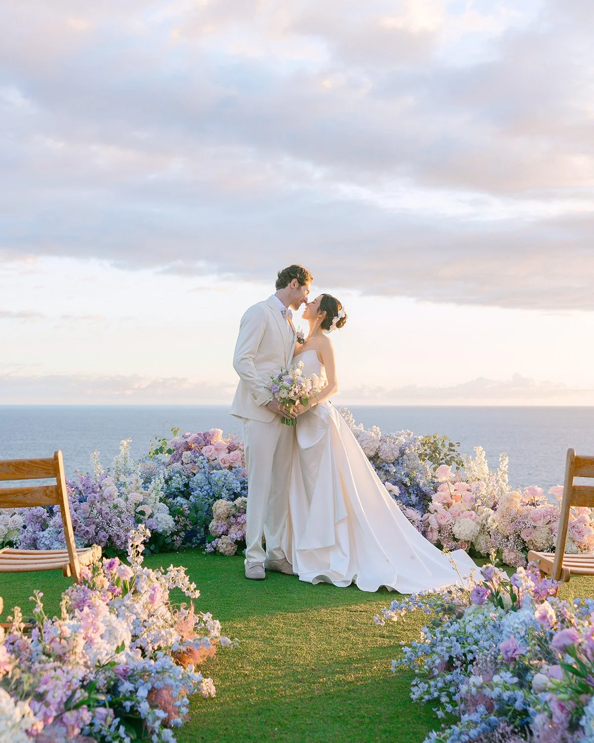 Lanai Four Seasons Resort Wedding Ceremony with pastel color floral design by dbhemingway