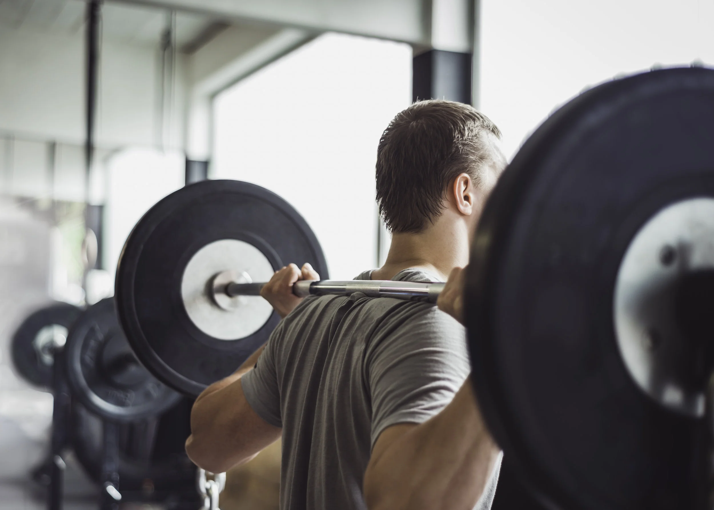storyblocks-working-out-in-a-cross-fit-box-lifting-weights_S4trZgCQM.jpg