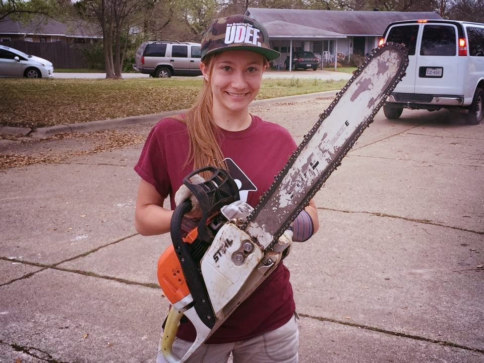 Happy Girl with Chainsaw.jpg