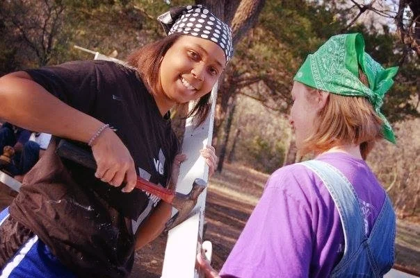 Girl with hammer pulling nails.jpg