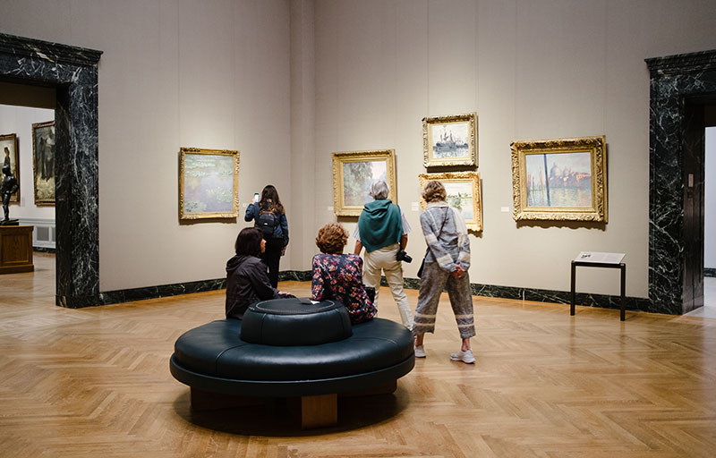 Looking at paintings, the Impressionism hall at MFA Boston, MA, May 2019.