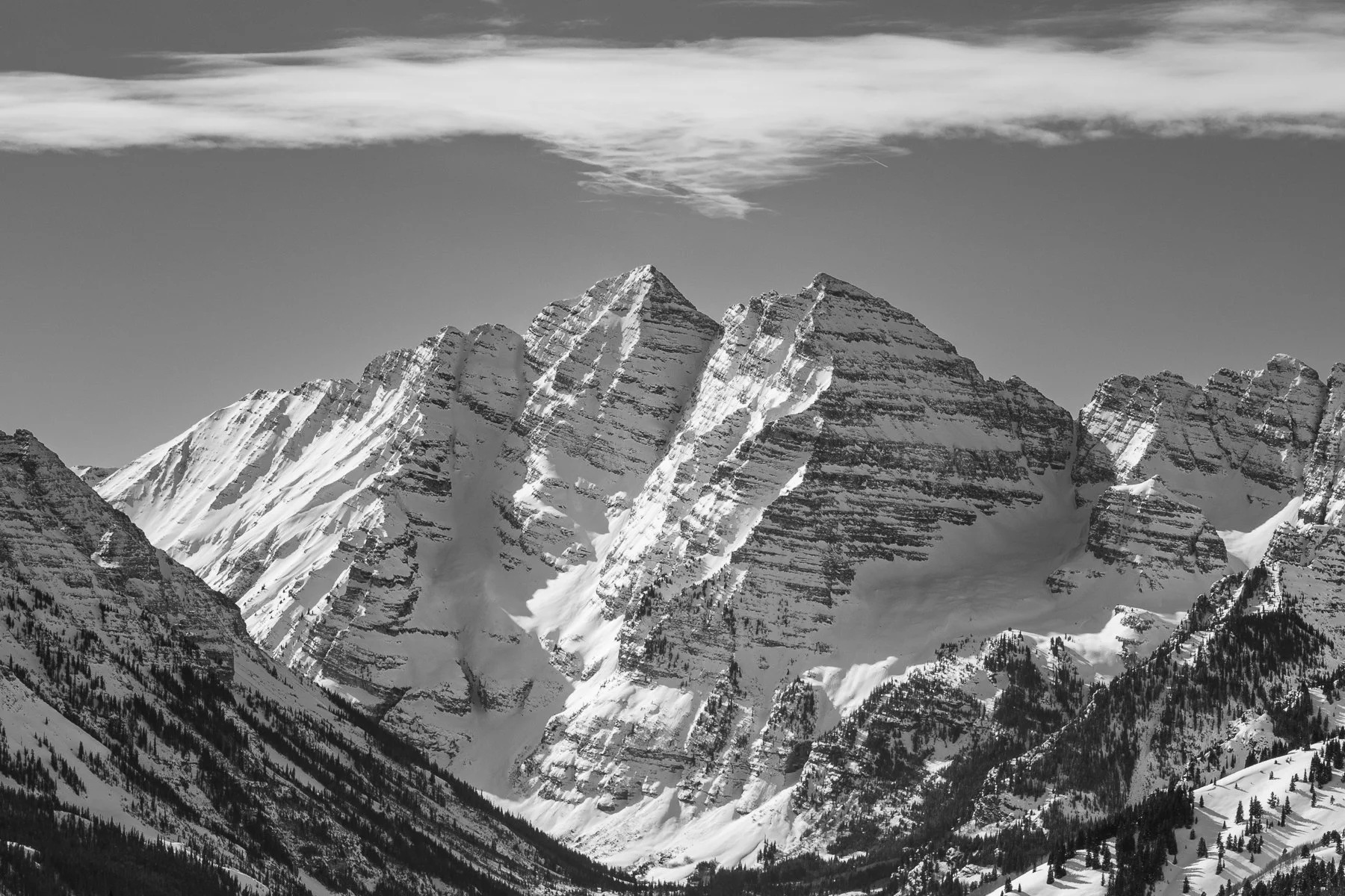Black and White Photograph of the Maroon Bells in the middle of winter seen from the top of Highlands Ski Resort near the town of Aspen, Colorado. (Copy)