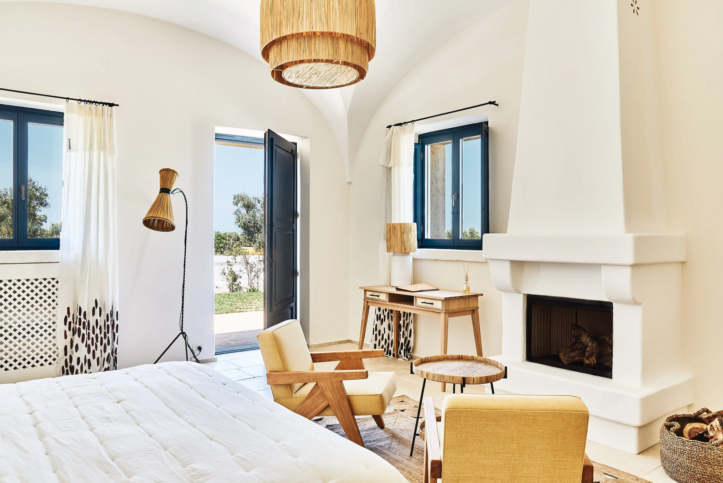 ight-filled vaulted suite with rustic Mediterranean interiors at Masseria Calderisi in Puglia.