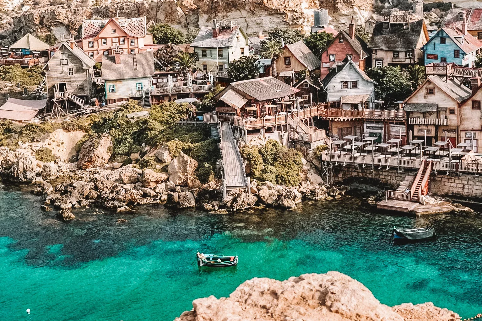 Colourful waterfront village and clear sea in Malta