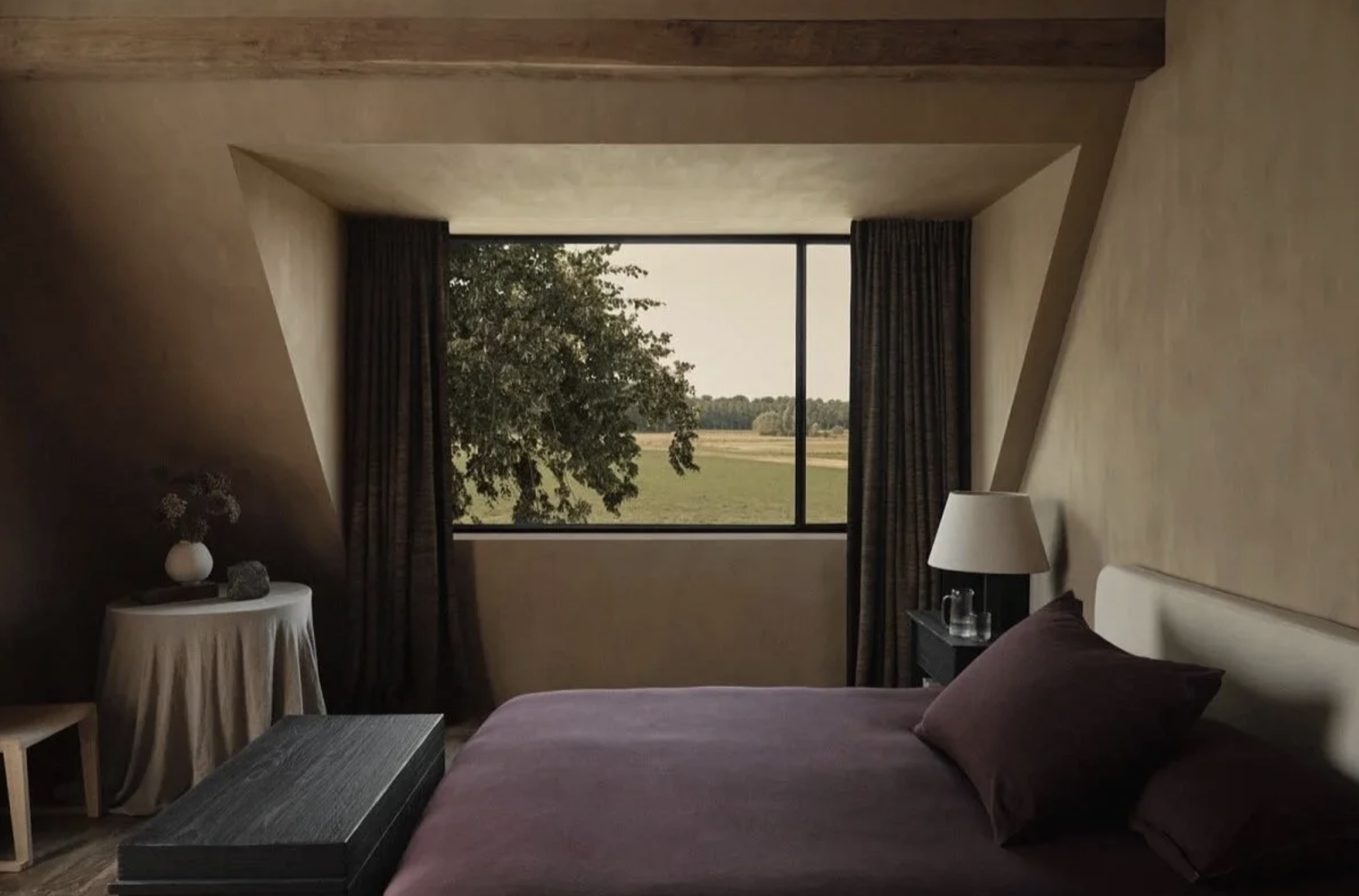 Moody, softly lit interior with arm tones and minimal, calming design details by Zara Home