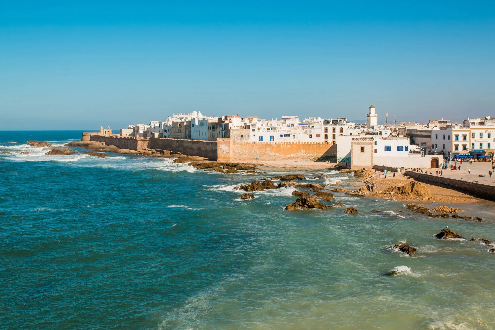 Essaouira, Morocco whitewashed medina walls and Atlantic coastline under clear spring sky