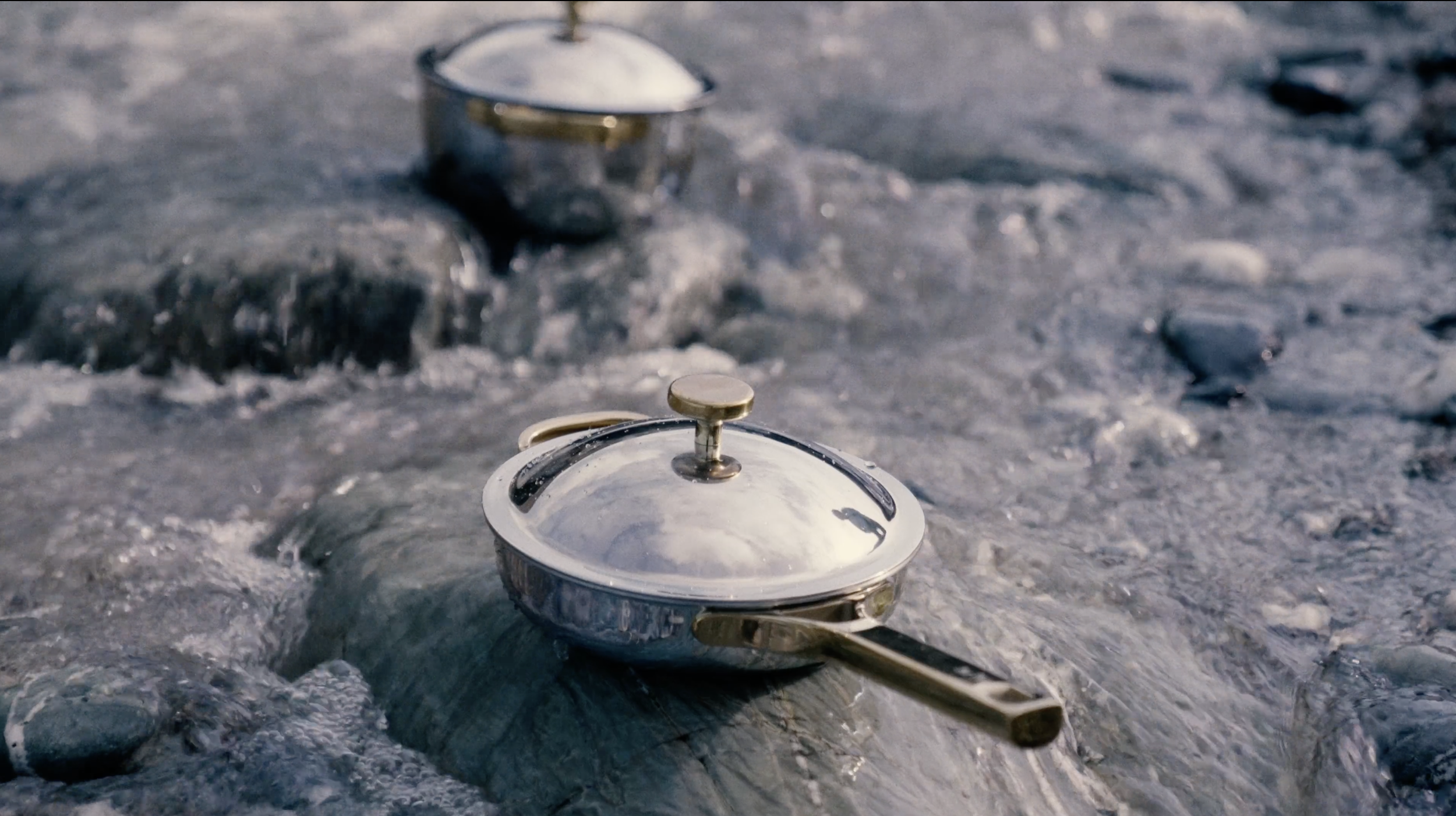 Luxury Our Place cookware pan styled in flowing seawater during a coastal Mother’s Day editorial shoot