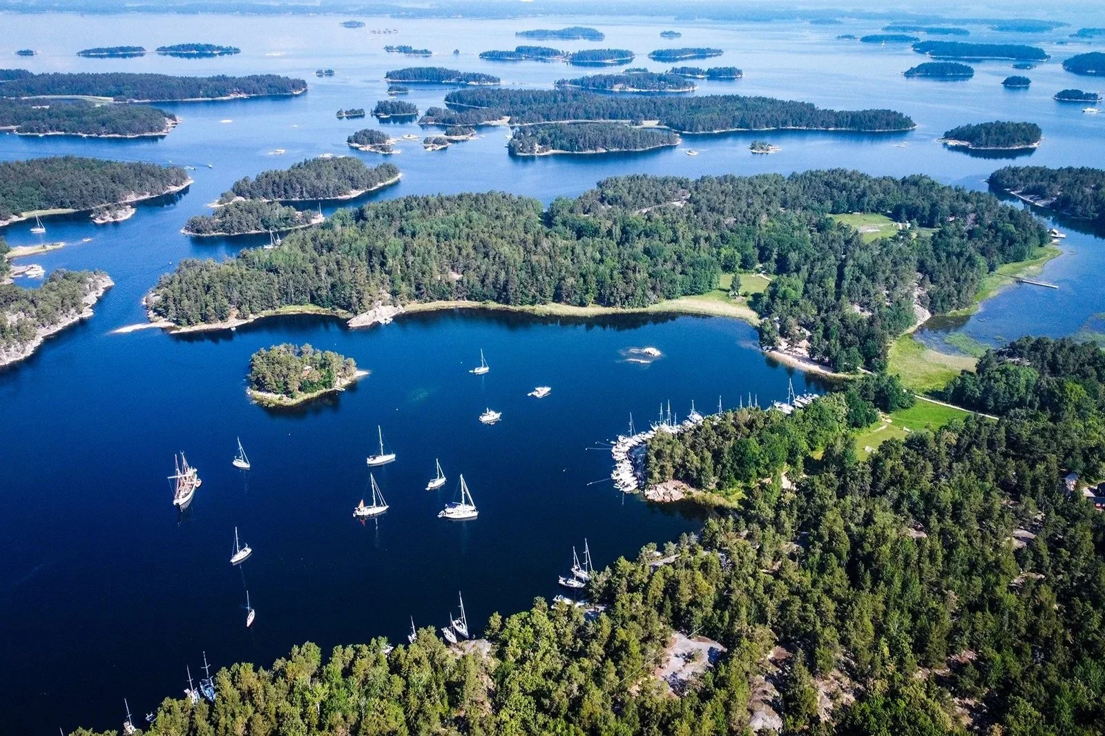 Aerial view of the Swedish archipelago islands surrounded by deep blue water