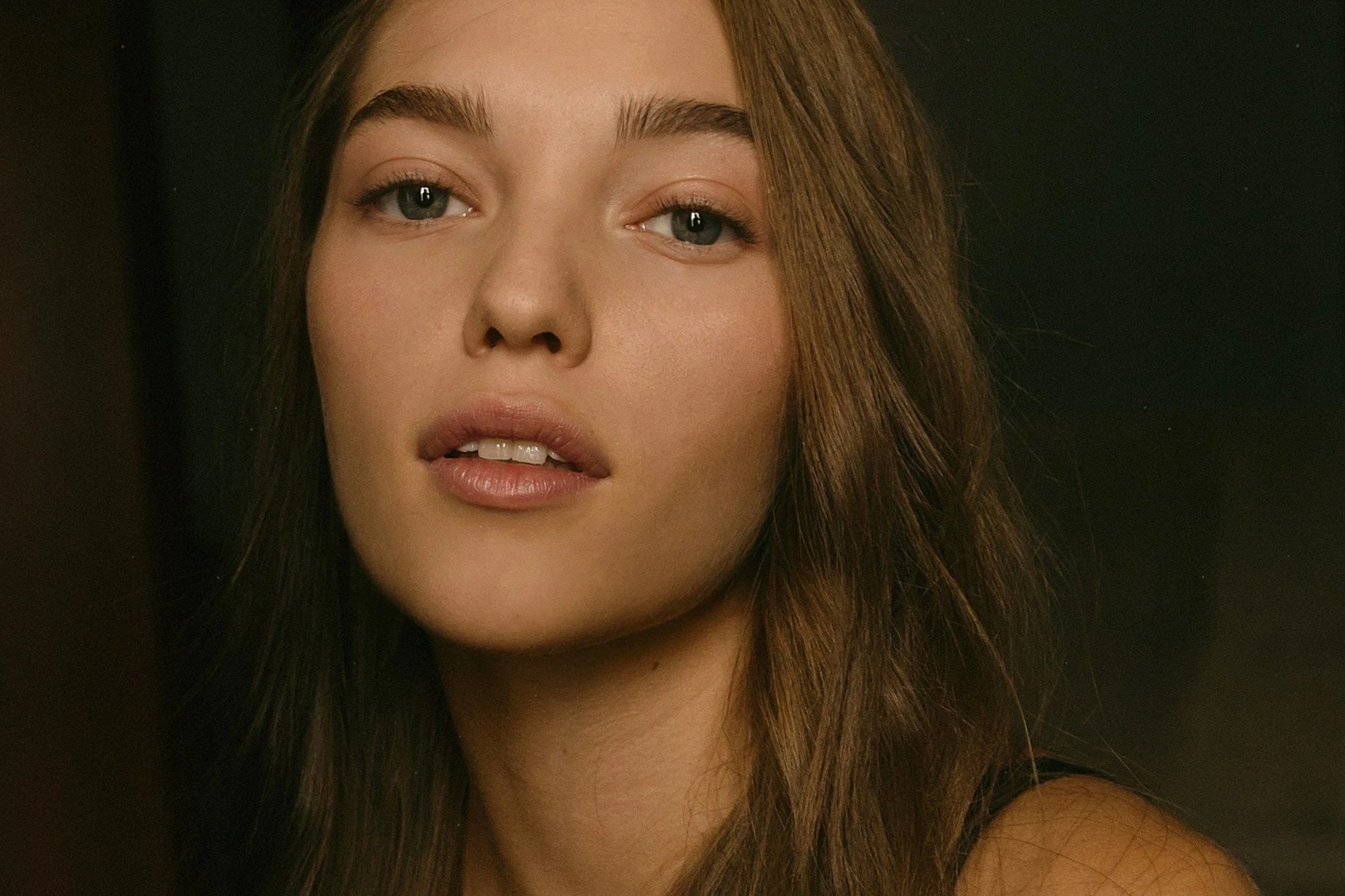Woman with naturally fuller-looking lips for a feature on lip plumping products and treatments without filler