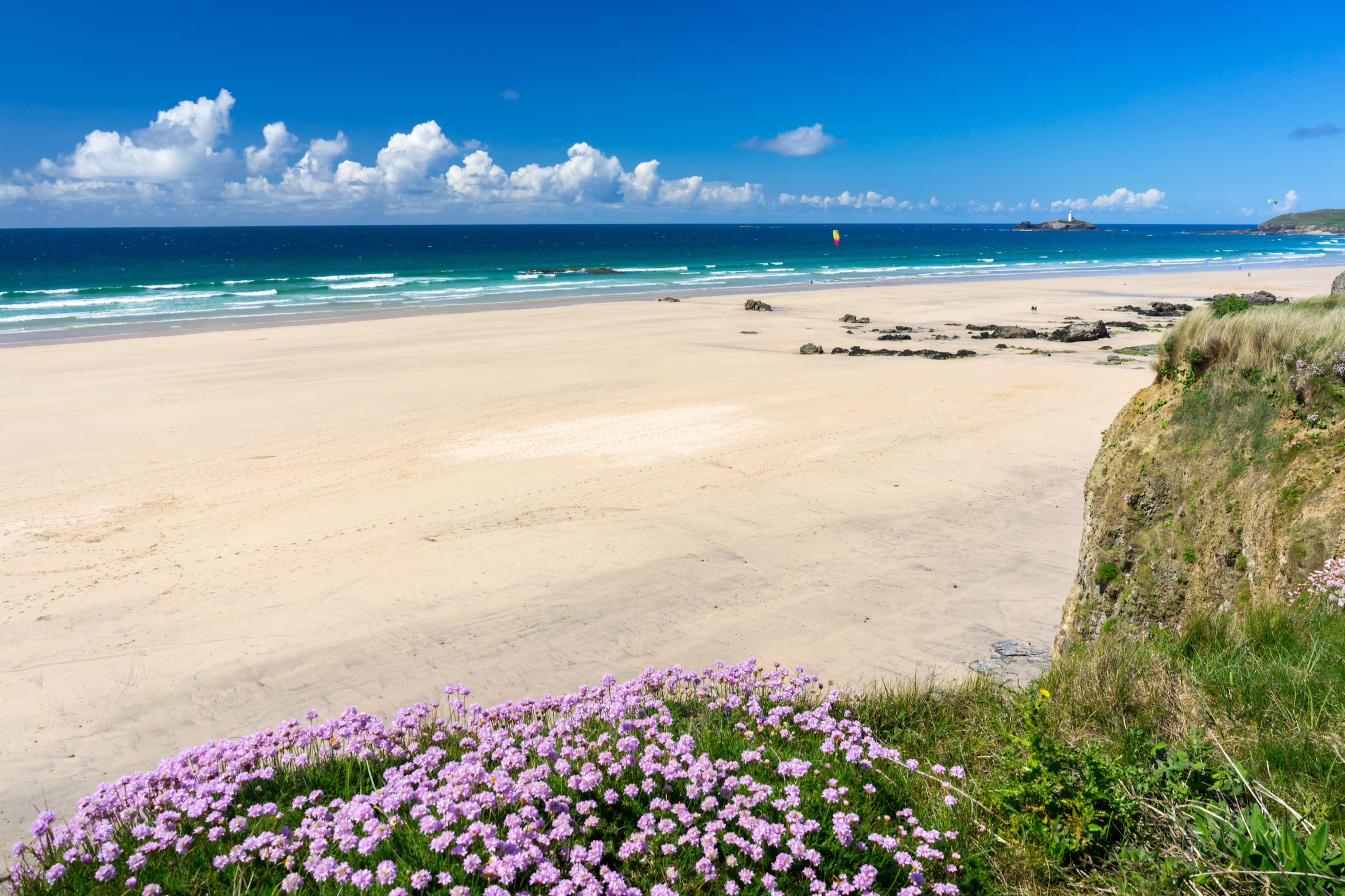 Godrevy and Gwithian beaches in Cornwall with golden sands, turquoise sea and views towards Godrevy Lighthouse.