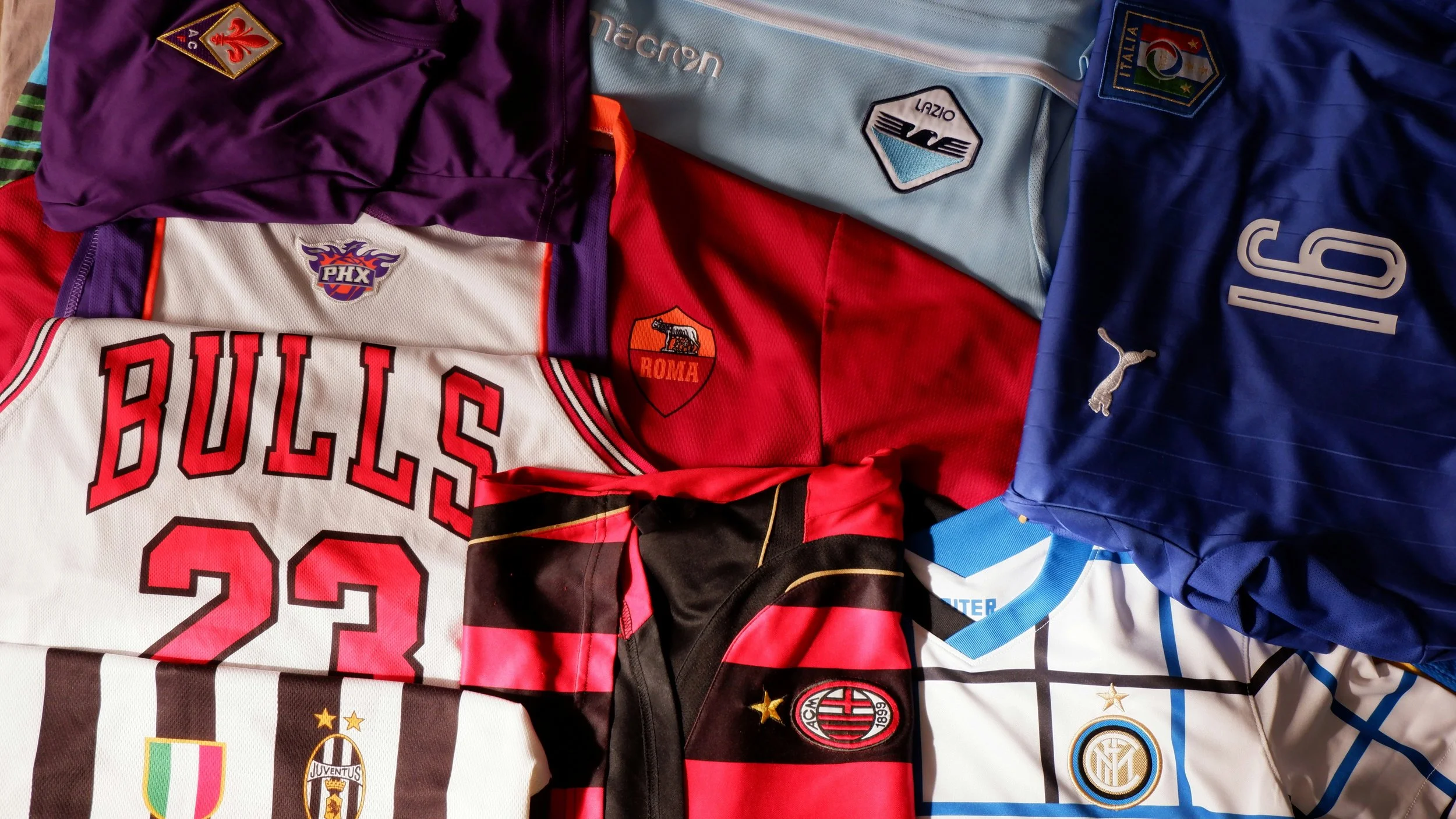 Collection of sports jerseys representing meaningful memorabilia and thoughtful gift ideas for sports fans.