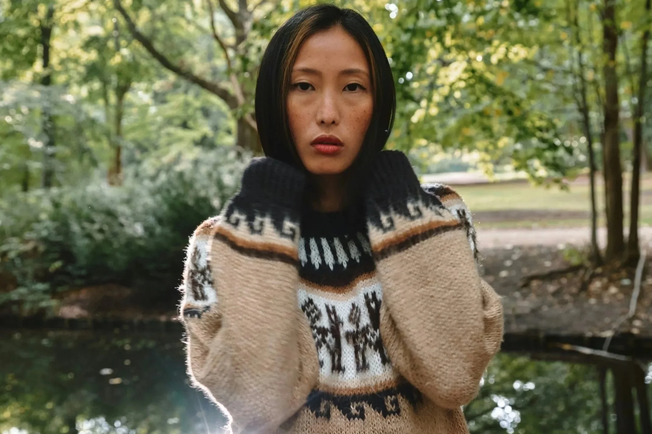 Woman outdoors in autumn wearing a patterned knit, illustrating skincare after 40 and changing skin needs