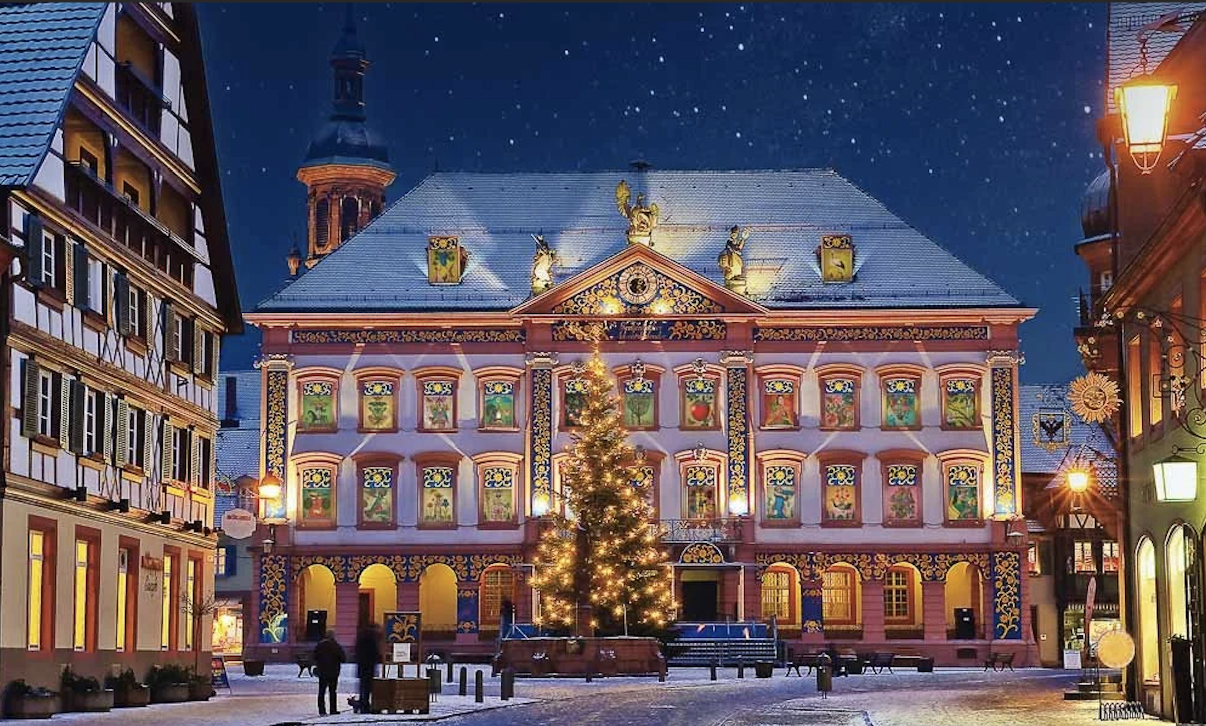 Historic Gengenbach town hall illuminated as a giant Advent calendar during Christmas in Germany's Black Forest.