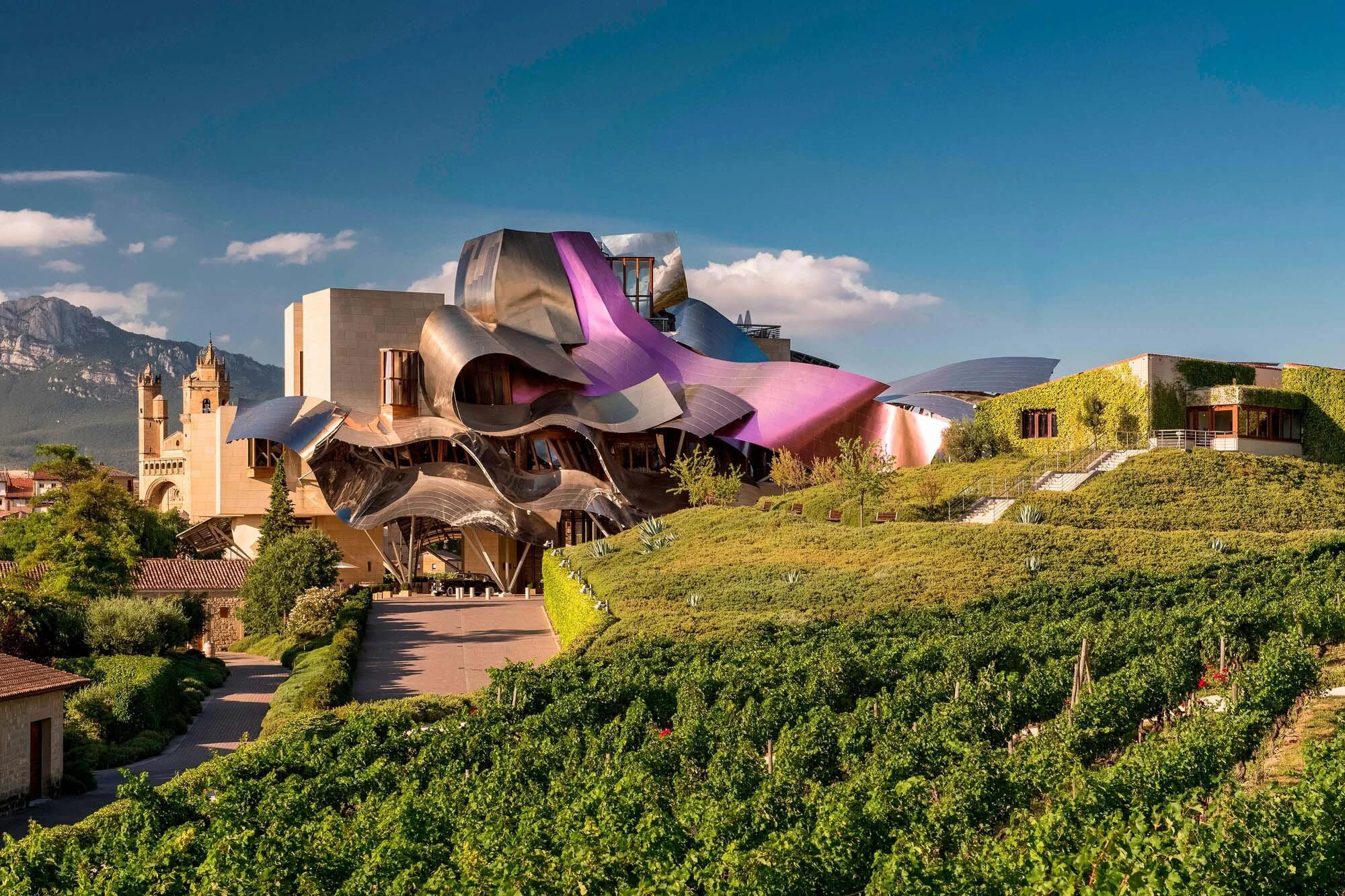 Frank Gehry designed Hotel Marqués de Riscal rising above Rioja vineyards in Elciego, Spain