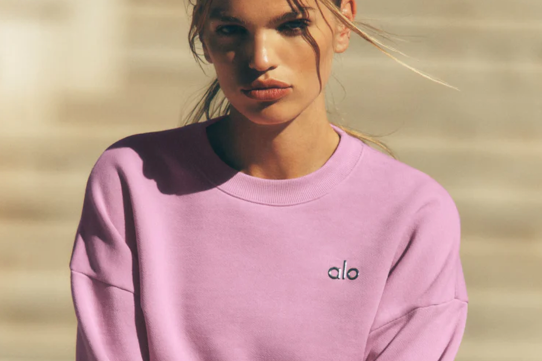 woman wears pink Alo Yoga 2025 winter collection