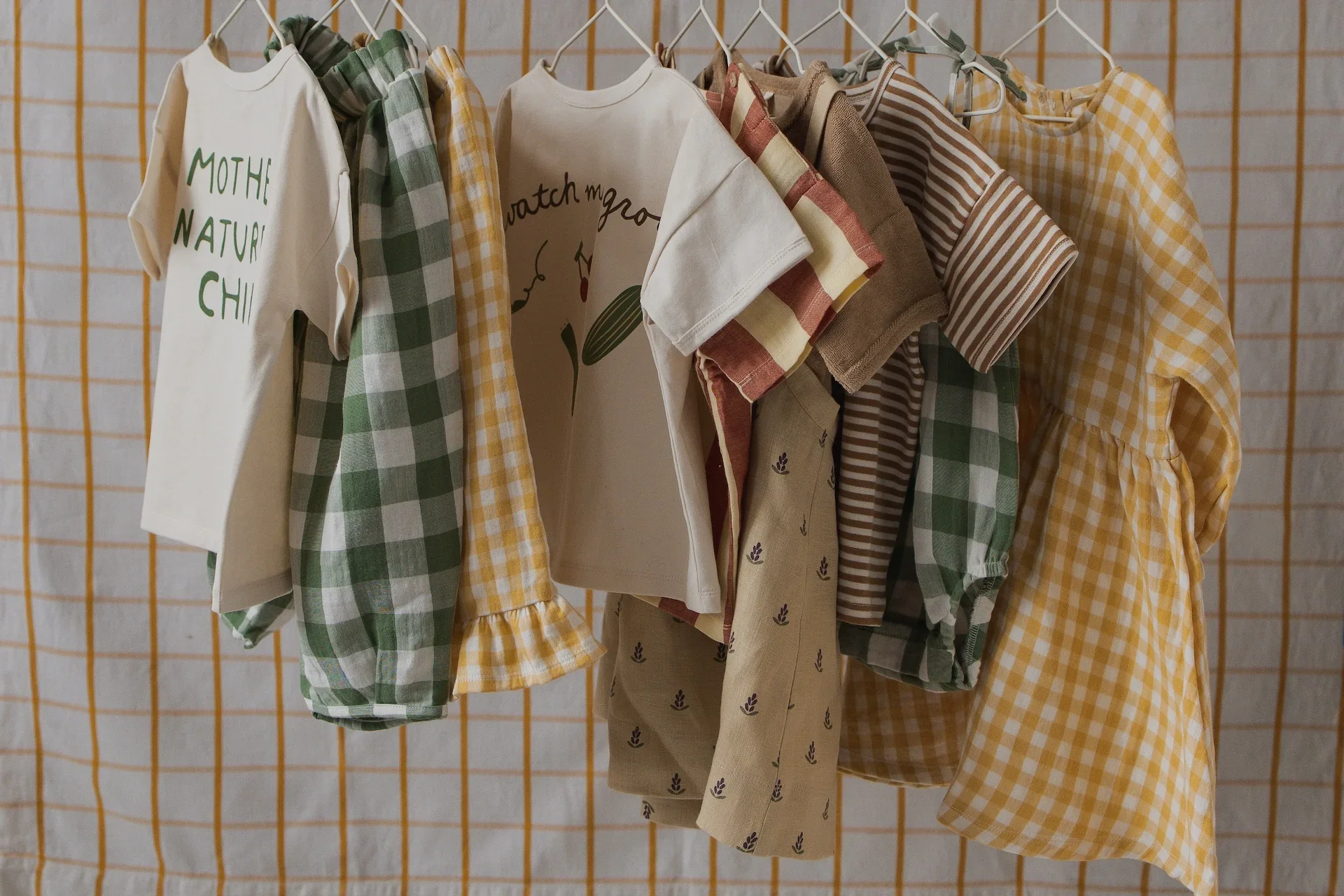 Organic Zoo children’s clothing rail neutral organic cotton kidswear soft tones lifestyle