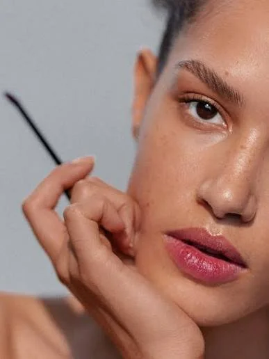Victoria Beckham Beauty model wearing softly diffused rose-pink lipstick with a subtle sheen.